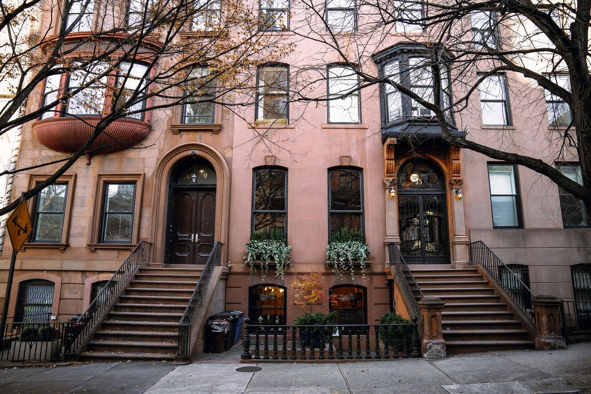 Brooklyn brownstones with stoops and autumn trees